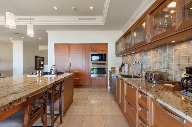 kitchen featuring sink, light stone counters, tasteful backsplash, hanging light fixtures, and stainless steel appliances