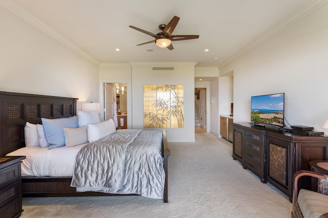 carpeted bedroom with ornamental molding and ceiling fan