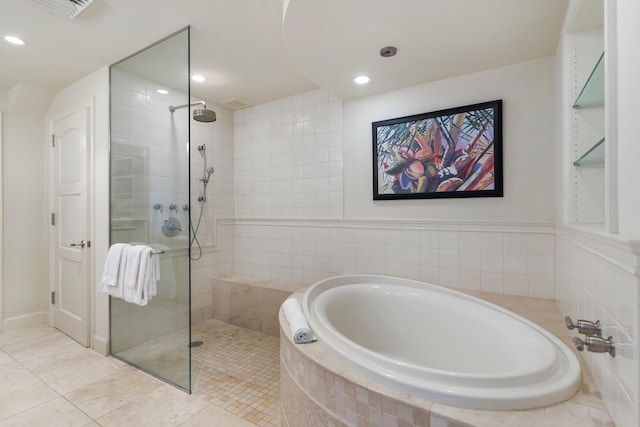 bathroom featuring shower with separate bathtub and tile patterned floors