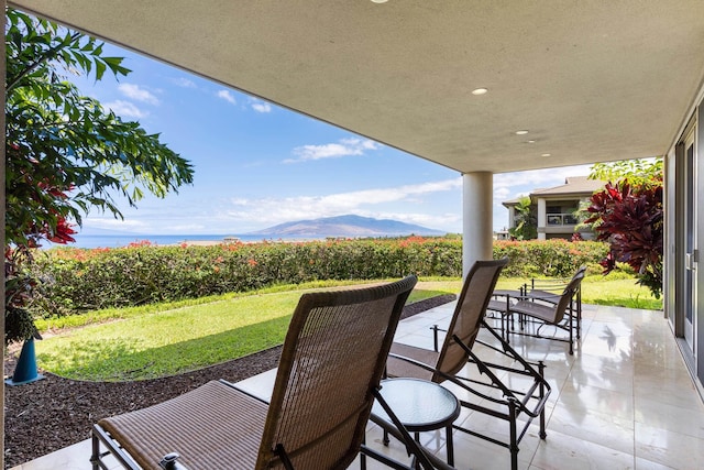 view of patio / terrace featuring a mountain view