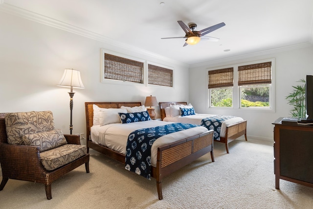 bedroom featuring ceiling fan, light colored carpet, and ornamental molding