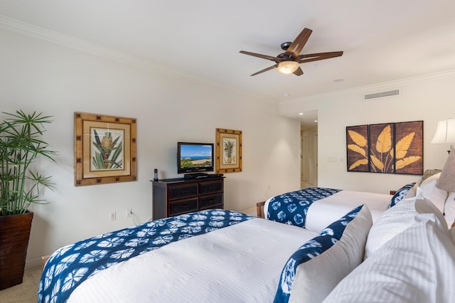 carpeted bedroom featuring crown molding and ceiling fan