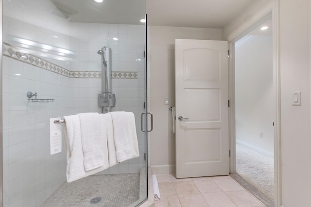 bathroom with tile patterned floors and walk in shower