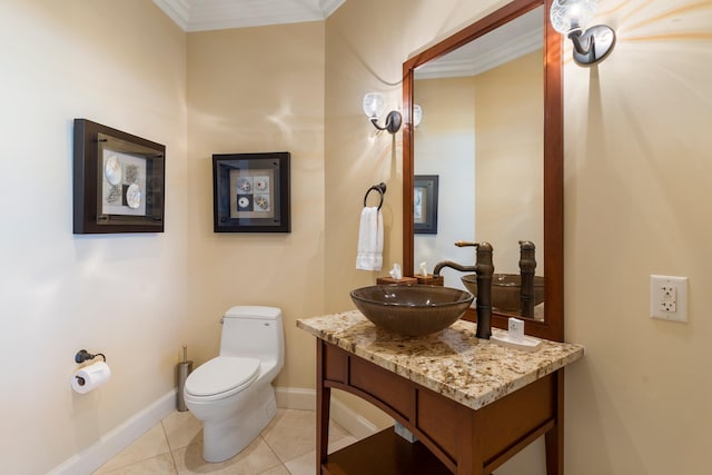 bathroom with vanity, ornamental molding, tile patterned floors, and toilet