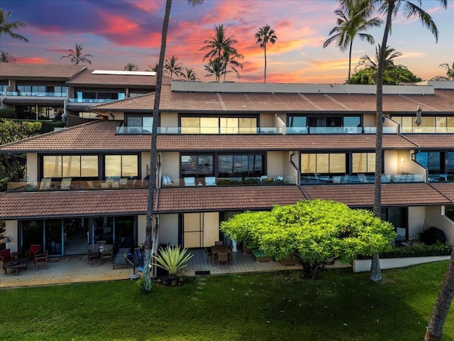 view of outdoor building at dusk