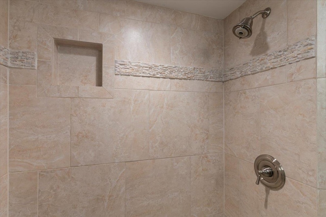 details with a tile shower