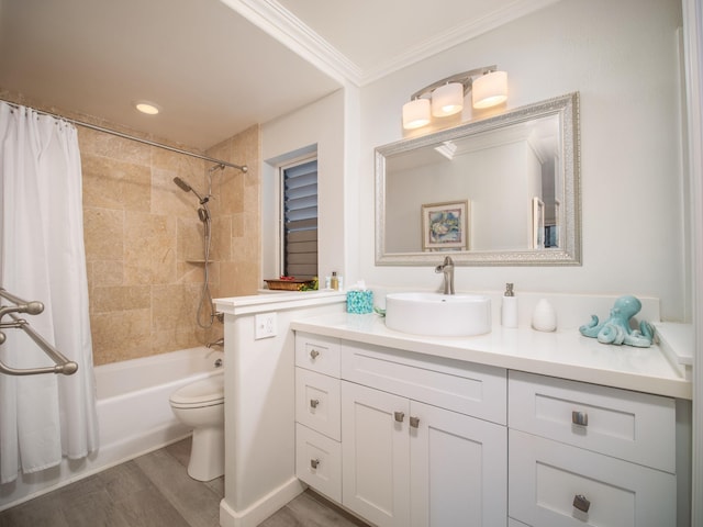 full bathroom featuring vanity, shower / tub combo with curtain, crown molding, hardwood / wood-style floors, and toilet