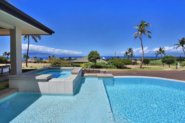 view of pool featuring an in ground hot tub and a mountain view