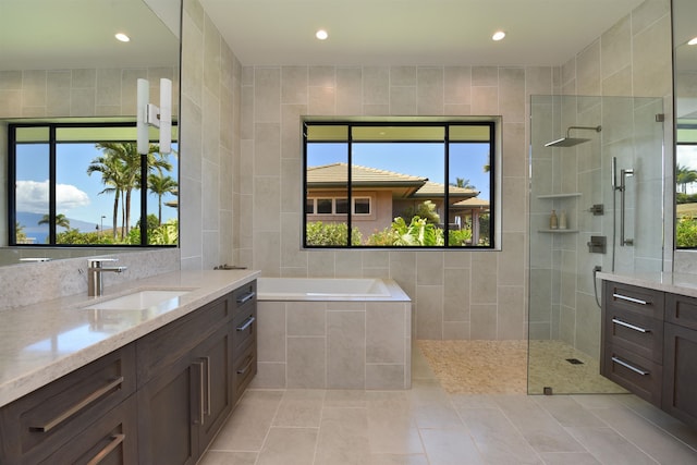 bathroom featuring vanity and tile walls