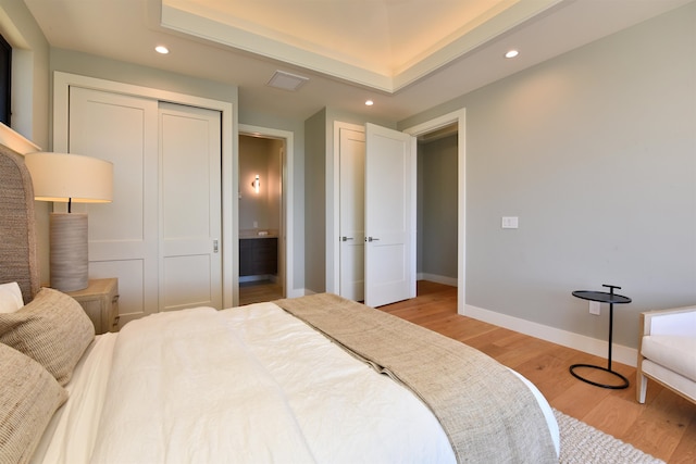 bedroom featuring a closet and light wood-type flooring