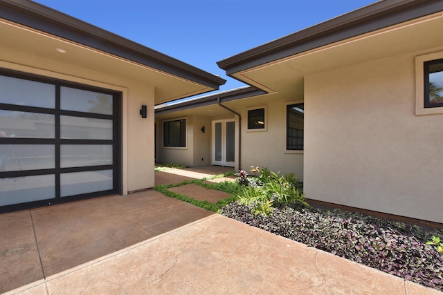 doorway to property with a patio