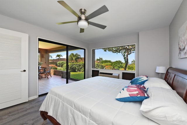 bedroom with access to outside, ceiling fan, and dark hardwood / wood-style floors