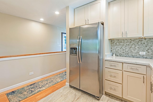 3788 Lower Honoapiilani Rd Unit D101, Lahaina, HI 96761 - kitchen featuring stainless steel fridge with ice dispenser, tasteful backsplash, recessed lighting, and light stone countertops