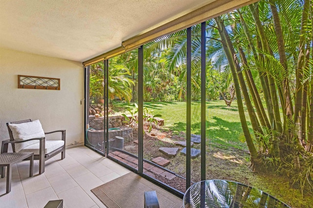 3788 Lower Honoapiilani Rd Unit D101, Lahaina, HI 96761 - sunroom / solarium featuring expansive windows, a textured ceiling, tile patterned flooring, and healthy amount of natural light