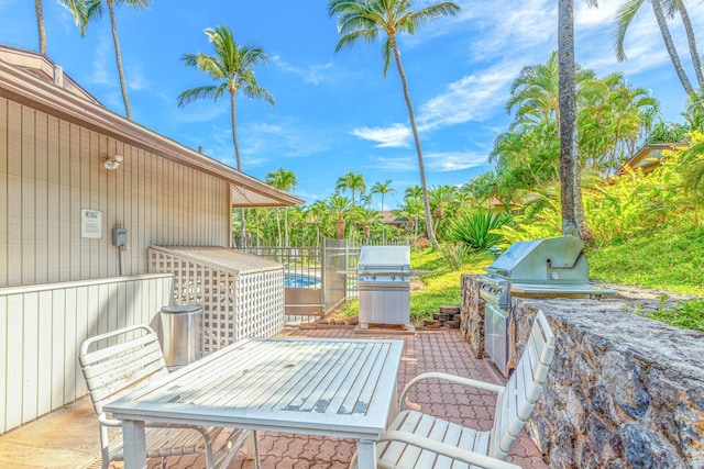 3788 Lower Honoapiilani Rd Unit D101, Lahaina, HI 96761 - view of patio featuring an outdoor kitchen and outdoor dining space