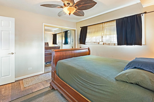 3788 Lower Honoapiilani Rd Unit D101, Lahaina, HI 96761 - bedroom with wood finished floors, a closet, multiple windows, and a ceiling fan
