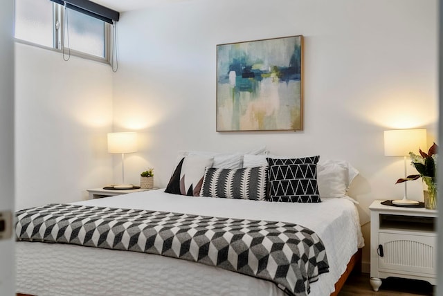 bedroom with wood-type flooring