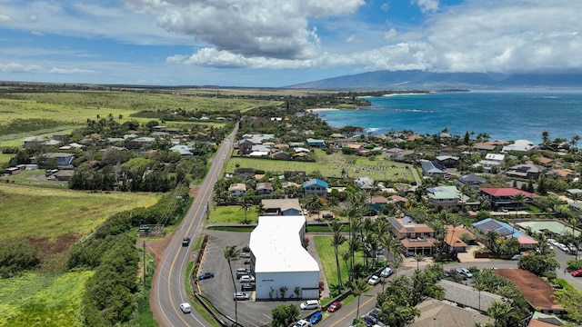 aerial view featuring a water and mountain view