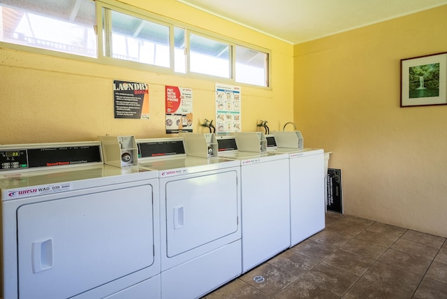 clothes washing area with washer and dryer