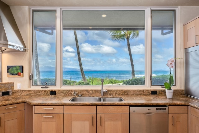 kitchen with a wealth of natural light, dishwasher, a water view, and sink