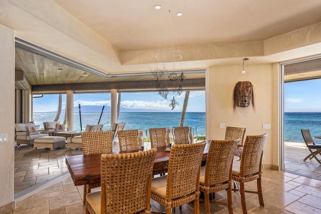 dining space with a water view