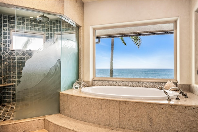 bathroom with a water view and independent shower and bath