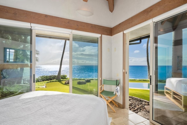 bedroom featuring access to outside and a water view