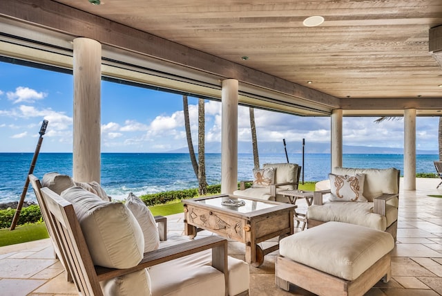 interior space featuring an outdoor living space and a water view