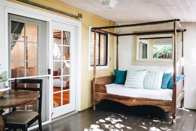 sunroom featuring wood ceiling