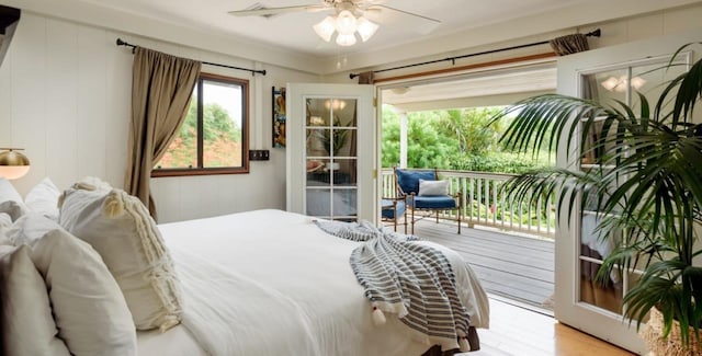 bedroom with light wood-type flooring, ceiling fan, access to exterior, and crown molding