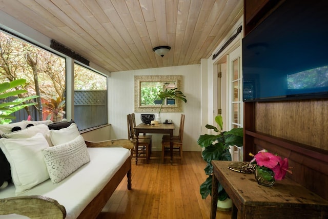 sunroom featuring wood ceiling