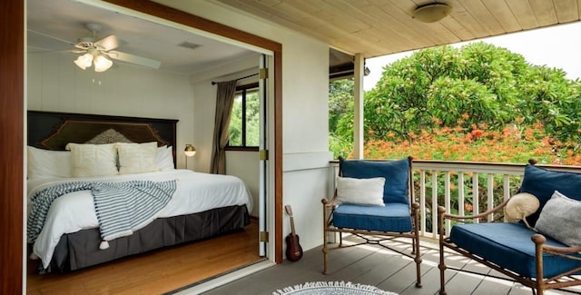 bedroom with ceiling fan, hardwood / wood-style floors, and wooden ceiling