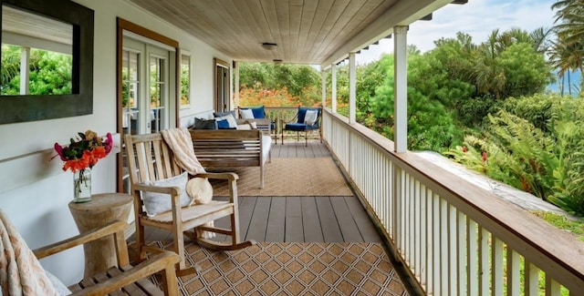 wooden deck featuring covered porch