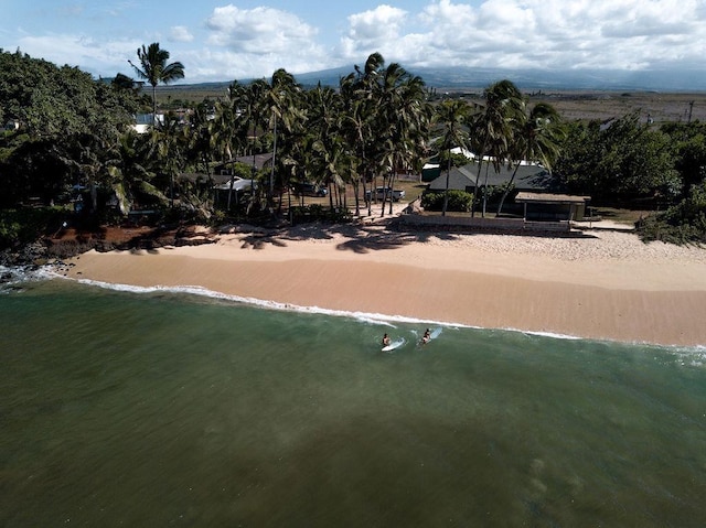 birds eye view of property featuring a view of the beach and a water view