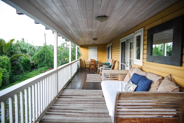 wooden terrace with outdoor lounge area