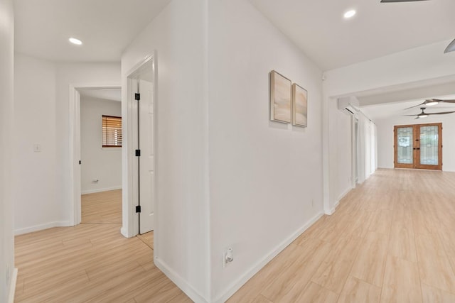 1395 Hiahia St, Wailuku, HI 96793 - hallway with light wood-type flooring, baseboards, a wall mounted air conditioner, recessed lighting, and french doors