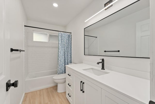 1395 Hiahia St, Wailuku, HI 96793 - bathroom featuring vanity, shower / bathtub combination with curtain, toilet, wood finished floors, and baseboards