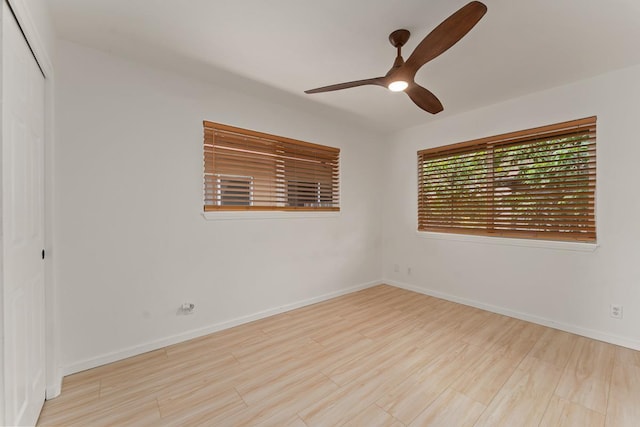1395 Hiahia St, Wailuku, HI 96793 - spare room with wood finished floors, a ceiling fan, and baseboards