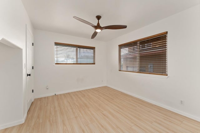 1395 Hiahia St, Wailuku, HI 96793 - empty room with wood finished floors, ceiling fan, and baseboards