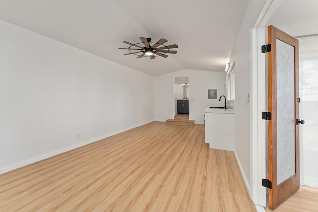 1395 Hiahia St, Wailuku, HI 96793 - unfurnished living room featuring a ceiling fan, a sink, lofted ceiling, light wood-style flooring, and baseboards