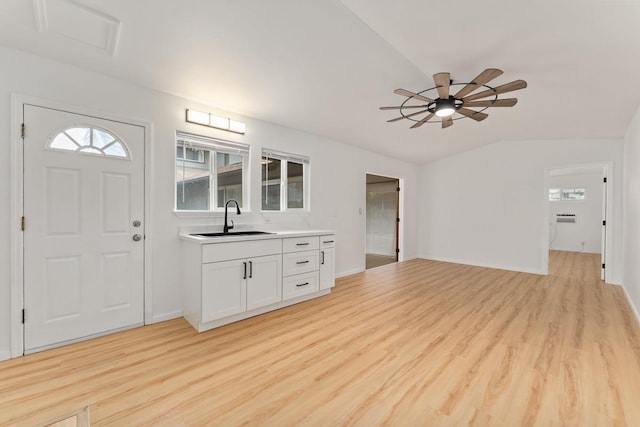 1395 Hiahia St, Wailuku, HI 96793 - foyer entrance with light wood-style floors, ceiling fan, baseboards, and lofted ceiling