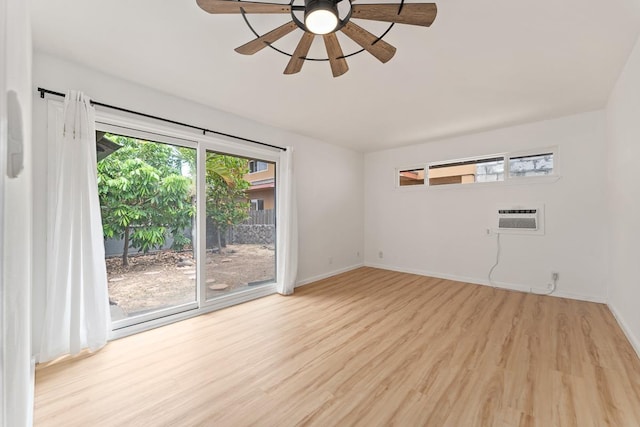 1395 Hiahia St, Wailuku, HI 96793 - unfurnished room featuring light wood finished floors, ceiling fan, baseboards, and an AC wall unit