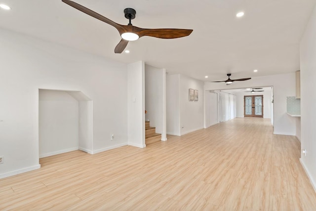 1395 Hiahia St, Wailuku, HI 96793 - unfurnished living room with ceiling fan, recessed lighting, baseboards, light wood-type flooring, and stairs