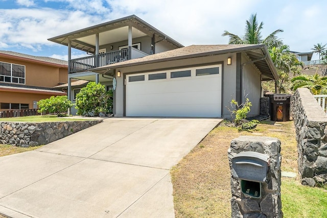 1395 Hiahia St, Wailuku, HI 96793 - view of front of house with a balcony, driveway, and a garage