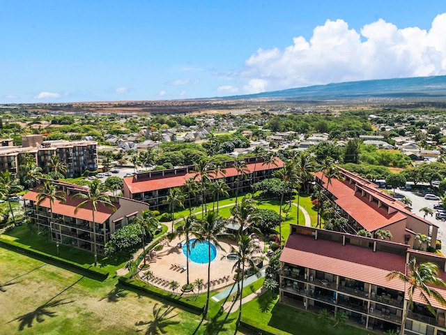 birds eye view of property with a mountain view