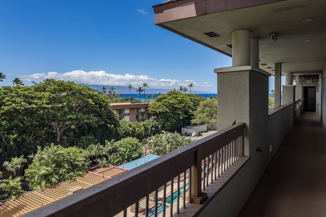 balcony featuring a water view