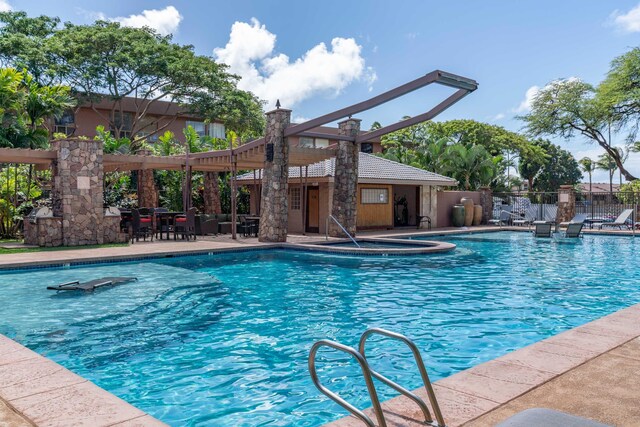 view of swimming pool with a patio area