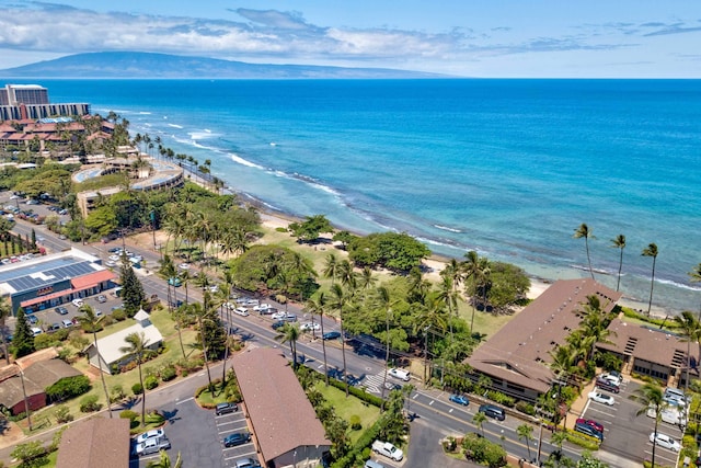 aerial view featuring a view of the beach and a water and mountain view