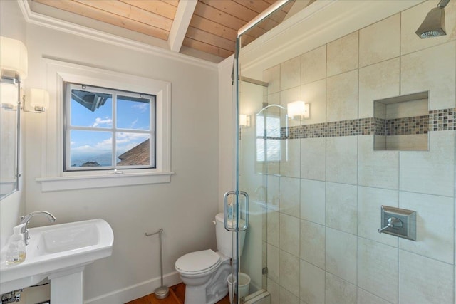 bathroom with beam ceiling, wood ceiling, an enclosed shower, crown molding, and toilet