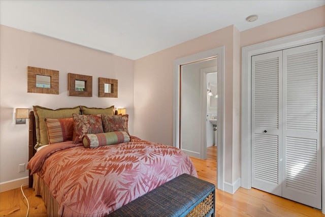 bedroom featuring light hardwood / wood-style floors and a closet